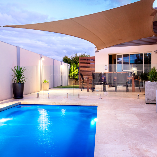 back yard pool with flush coping in coral spings florida